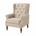 Poltrona imbottita in tessuto beige con gambe in legno